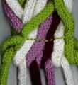 Как связать спицами декоративный шарф-косичка